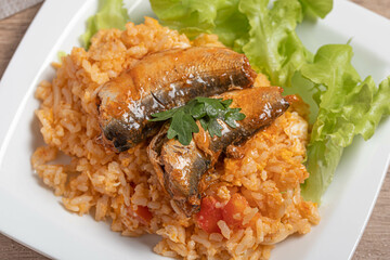 Fried rice with canned fish in a white plate.Thai food