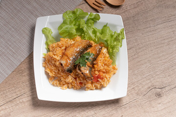 Fried rice with canned fish in a white plate.Thai food