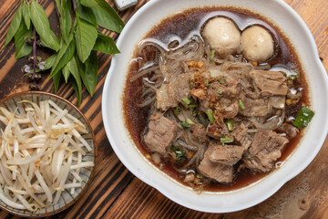 Braised pork noodles with vegetables.and pork balls with soup Thai food