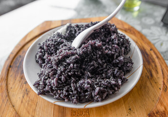 Traditional Chinese food cooked on a plate - black rice