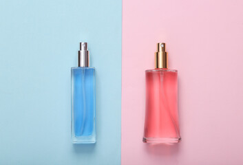 Blue and pink perfume bottle on two tone pastel background. Top view