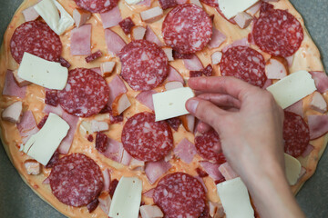 Cooking. The process of making pizza. Homemade pizza