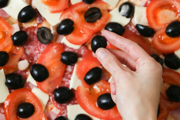 Cooking. The process of making pizza. Homemade pizza