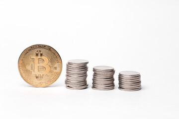 Golden bitcoin with a stack of coins on a white background