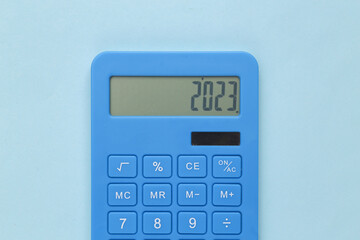 Calculator with the number 2023. Budget 2023, payment of taxes