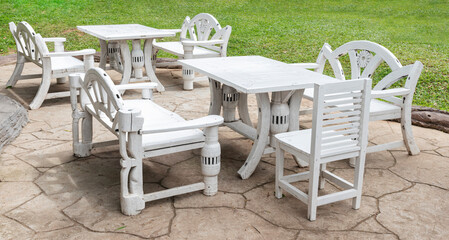 White outdoor wooden chair and table retro style at lawn coffee shop