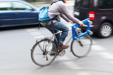 bicycle rider in city traffic