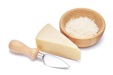 Piece of parmesan cheese, knife and grated cheese in wooden bowl isolated on white background