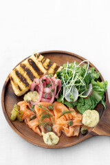 salmon gravlax platter with salad and toast in sweden
