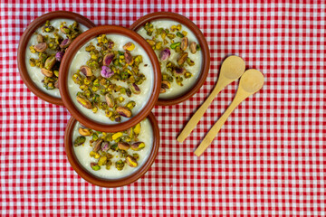 Milk Rice in pottery bowl flat lay, copy space.