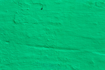 Green Textured Wall Background. Abstract background of green plaster.



