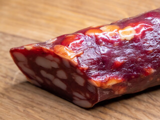 Smoked sausage on a cutting board, food close-up shot.