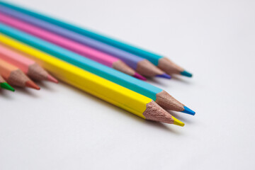Set of colored pencils, school equipment on the table