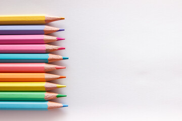 Set of colored pencils, school equipment on the table