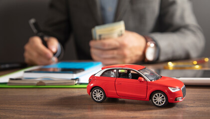 Insurance agent signs a document. Car insurance