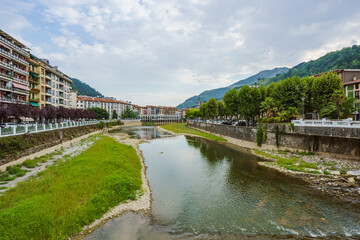 Fototapeta na wymiar View of the Oria River as it flows through Tolosa, a city in Gipuzkoa, Basque Country