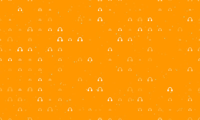 Seamless background pattern of evenly spaced white headphones symbols of different sizes and opacity. Vector illustration on orange background with stars