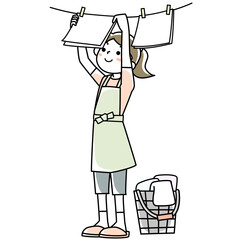 洗濯物を干す若い女性