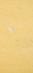 Fragment of yellow wall with scratches and cracks