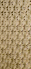 Texture of intertwined beige plastic rods. Backrest of a garden chair. Texture pattern for design
