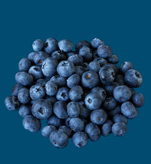 blueberries lie on a dark background, farm harvest