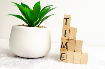 word time on wooden blocks and white wooden background