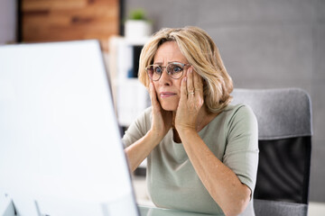 Frustrated Businesswoman Looking At Her Computer Screen