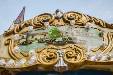 The decorations on the children's carousel with wooden horses