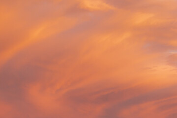 Red yellow and orange sunset. Dramatic sunset with evening sky clouds illuminated by bright sunlight