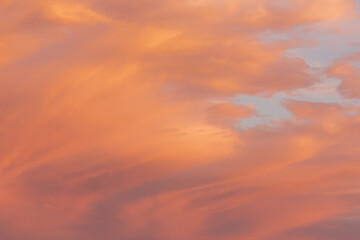 Red yellow and orange sunset. Dramatic sunset with evening sky clouds illuminated by bright sunlight