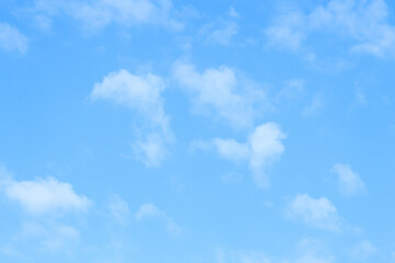 Naklejka na ściany i meble Blue sky background and white clouds soft focus, pastel sky.