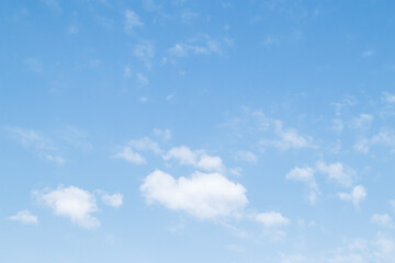 Blue sky background and white clouds soft focus, pastel sky.