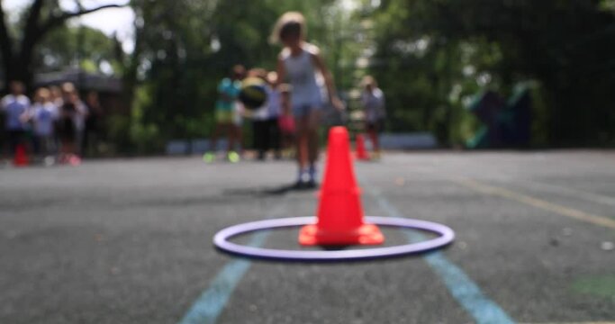 boys and girls of school age run chasing on the sports ground. The concept of healthy parenting. Children's sports competitions. blurred focus