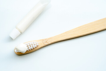 Eco-friendly toothbrush with wooden bamboo handle.