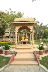Radha Krishna temple in garden, Krishna playing the flute