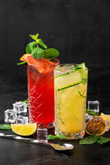 Red and yellow cocktails on black background