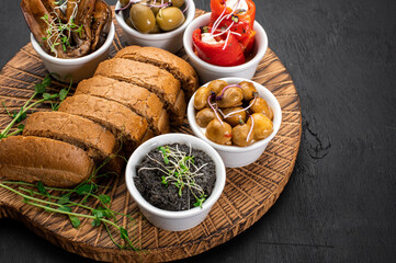 Dish with assorted marinated vegetables on wooden background