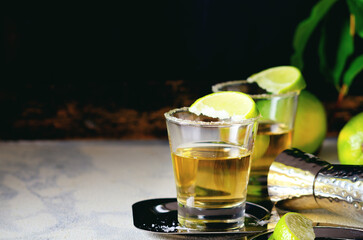 Golden tequila shots with sea salt, juicy lime.
