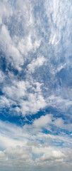 Fantastic clouds against blue sky, panorama