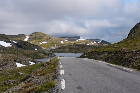 Majestic landscapes with lakes, rocks and snowcapped mountains on the Aurlandsfjellet scenic route, Norway