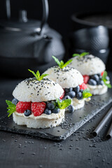 Sweet sushi burger with berries and mascarpone as Japanese cuisine.