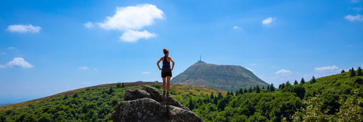 standing woman looking at panoramic view of Puy de Dome