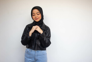 Beautiful young Asian Muslim feel impressed and happy, standing over white background