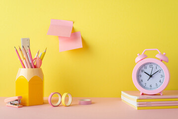 School accessories concept. Photo of alarm clock over copybooks pencil holder adhesive tape mini...