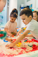 children's creativity, kinetic sand games with various forms of mold. High quality photo