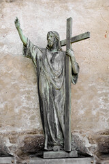 Religious statue of Jesus Christ carrying his cross, on the way to crucifixion.