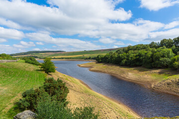 Leighton Reservoir in Nidderdale, North Yorkshire, UK in August 2022  with seriously low water levels due to no rainfall for many weeks resulting in a hosepipe ban.  Horizontal. Copy space