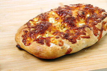 Freshly baked cheese flavored flat bread