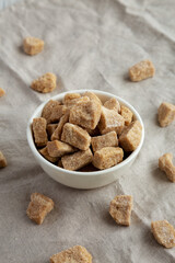 Raw Organic Demerara Granulated Brown Sugar in a Bowl, side view.