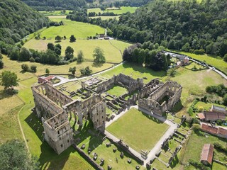 Rievaulx Abbey ree-VOH was a Cistercian abbey in Rievaulx, situated near Helmsley in the North York...